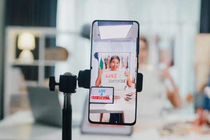 Smartphone recording a creator for a short-form social media livestream