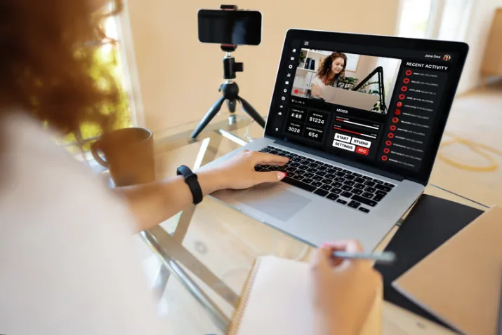 Laptop displaying video content management and analytics tools